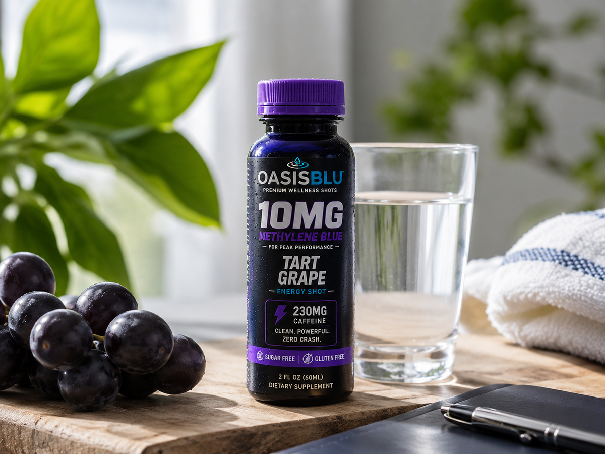 Oasis Blu supplement bottle with grapes and water on a table