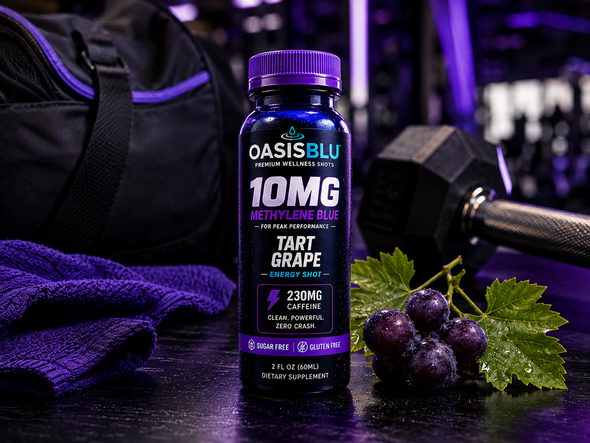 Oasis Blu energy shot bottle with grapes and gym equipment in the background